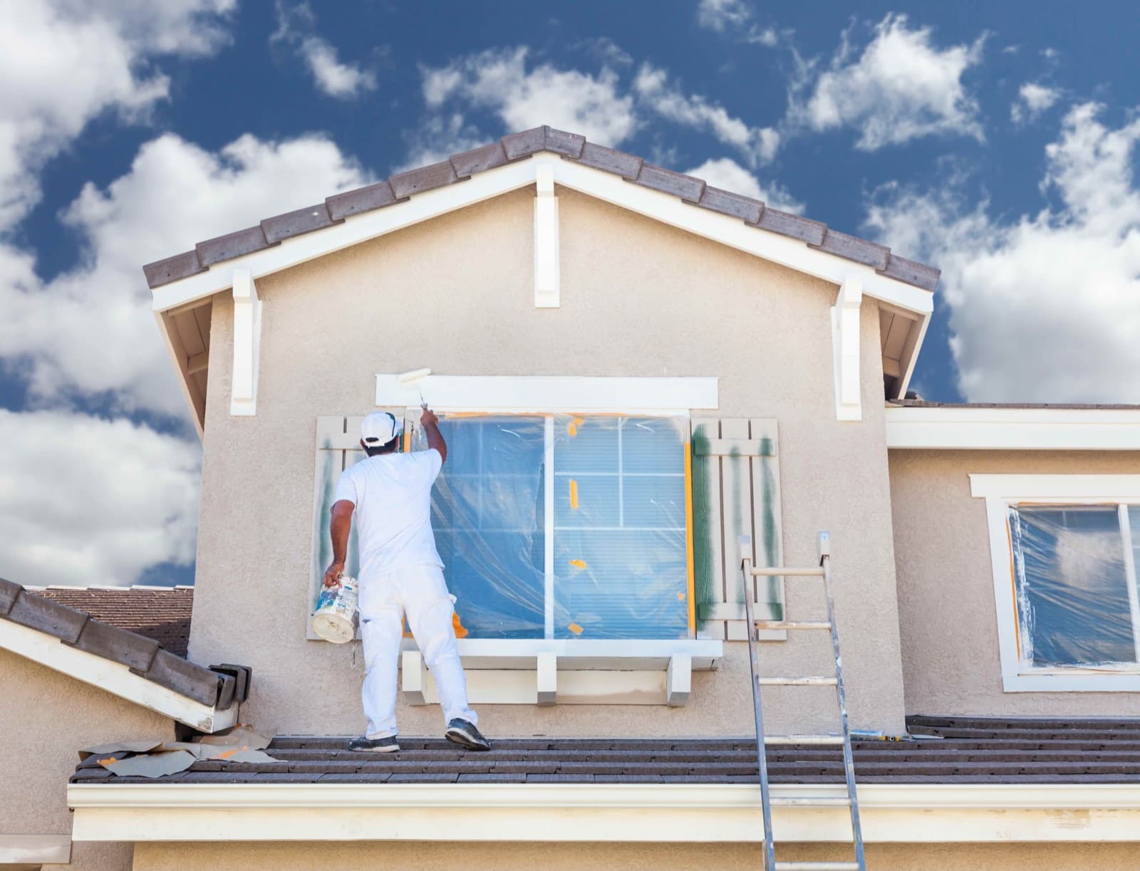 Painter working on a residential exterior
